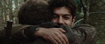Movie still from “Miracle at St. Anna” (2008), directed by Spike Lee – A man hugging another man with his arms wrapped around him; Close Up shot, Over the shoulder angle