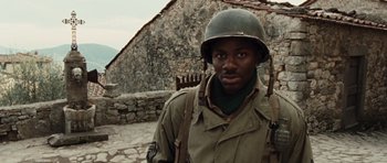 Movie still from “Miracle at St. Anna” (2008), directed by Spike Lee – A man in a military uniform with a helmet on his head; Close Up shot, High angle