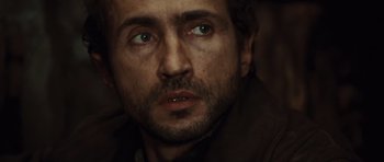 Movie still from “Miracle at St. Anna” (2008), directed by Spike Lee – A person with green eyes; Close Up shot, Over the shoulder angle