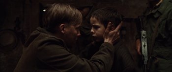 Movie still from “Miracle at St. Anna” (2008), directed by Spike Lee – Two young men touching each other's ears; Close Up shot, Over the shoulder angle