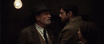 Movie still from “Miracle at St. Anna” (2008), directed by Spike Lee – A man and a man wearing a suit and hat; Close Up shot, Over the shoulder angle