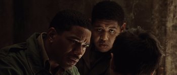 Movie still from “Miracle at St. Anna” (2008), directed by Spike Lee – A couple of men standing next to each other; Close Up shot, High angle