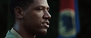 Movie still from “Miracle at St. Anna” (2008), directed by Spike Lee – A man's face in a dark room; Close Up shot, Low angle