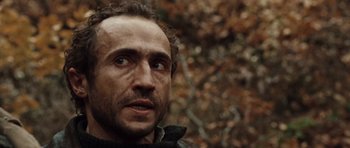 Movie still from “Miracle at St. Anna” (2008), directed by Spike Lee – A person looking at the camera; Close Up shot, Low angle