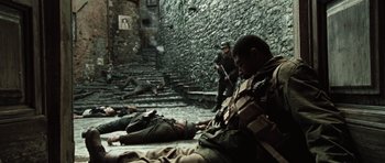 Movie still from “Miracle at St. Anna” (2008), directed by Spike Lee – A group of soldiers laying on the ground; Wide shot, High angle