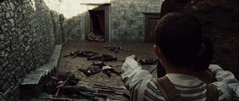 Movie still from “Miracle at St. Anna” (2008), directed by Spike Lee – A group of dead bodies laying on the ground; Wide shot, High angle