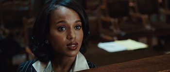 Movie still from “Miracle at St. Anna” (2008), directed by Spike Lee – A person sitting at a table; Close Up shot, Over the shoulder angle