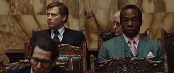 Movie still from “Miracle at St. Anna” (2008), directed by Spike Lee – A group of men sitting in chairs in a room; Close Up shot, Over the shoulder angle