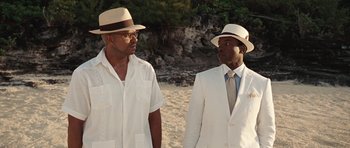 Movie still from “Miracle at St. Anna” (2008), directed by Spike Lee – A couple of men standing next to each other on a beach; Medium shot, Over the shoulder angle