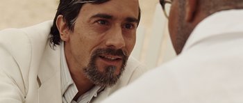 Movie still from “Miracle at St. Anna” (2008), directed by Spike Lee – A person wearing a white shirt; Close Up shot, Over the shoulder angle