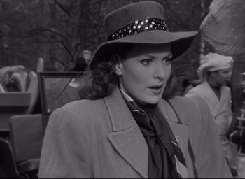 Movie still from “Miracle on 34th Street” (1947), directed by George Seaton – A black and white photo of a woman wearing a hat; Close Up shot, Low angle