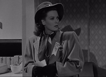 Movie still from “Miracle on 34th Street” (1947), directed by George Seaton – A black and white photo of a woman in a hat; Medium shot, Low angle