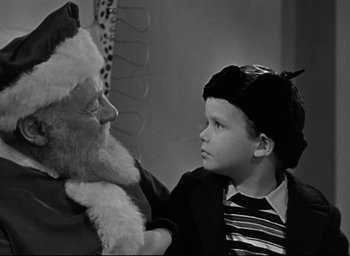 Movie still from “Miracle on 34th Street” (1947), directed by George Seaton – A young boy is looking at santa claus; Close Up shot, Over the shoulder angle