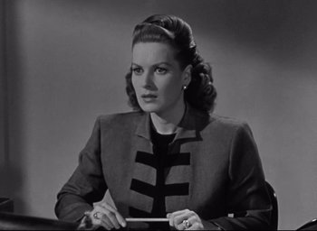 Movie still from “Miracle on 34th Street” (1947), directed by George Seaton – An old black and white photo of a woman in a suit; Close Up shot, High angle