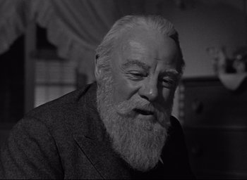 Movie still from “Miracle on 34th Street” (1947), directed by George Seaton – An old man with a beard and a suit; Close Up shot, Low angle