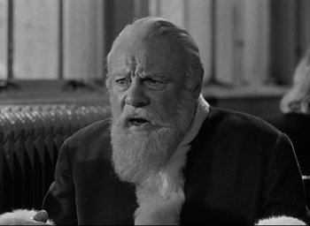 Movie still from “Miracle on 34th Street” (1947), directed by George Seaton – An old man with a beard is sitting in a chair; Close Up shot, Over the shoulder angle