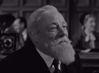 Movie still from “Miracle on 34th Street” (1947), directed by George Seaton – An old man with a beard and a suit; Close Up shot, Low angle