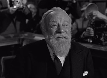 Movie still from “Miracle on 34th Street” (1947), directed by George Seaton – An old man with a beard is smiling for the camera; Close Up shot, Low angle