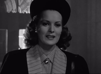 Movie still from “Miracle on 34th Street” (1947), directed by George Seaton – A black and white photo of a woman wearing a hat; Close Up shot, Low angle