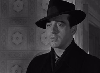 Movie still from “Miracle on 34th Street” (1947), directed by George Seaton – A black and white photo of a man in a hat; Close Up shot, Low angle