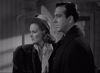 Movie still from “Miracle on 34th Street” (1947), directed by George Seaton – A man and a woman standing next to each other; Medium shot, Low angle