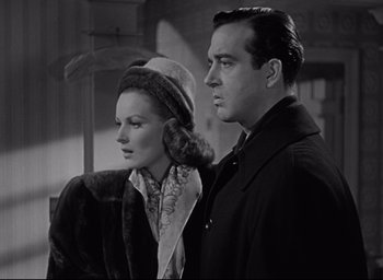 Movie still from “Miracle on 34th Street” (1947), directed by George Seaton – A man and a woman standing next to each other; Medium shot, Low angle