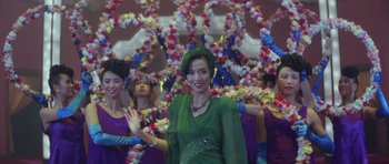 Movie still from “Miracles: The Canton Godfather” (1989), directed by Jackie Chan – A group of women standing next to each other; Medium shot, Low angle