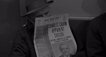 Movie still from “Mirage” (1965), directed by Edward Dmytryk – A man in a hat reading a newspaper; Close Up shot, Low angle