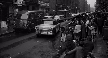 Movie still from “Mirage” (1965), directed by Edward Dmytryk – An old photo of a busy city street in the 1 9 5 0's; Wide shot, High angle