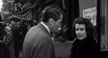 Movie still from “Mirage” (1965), directed by Edward Dmytryk – A man and a woman talking to each other; Close Up shot, Over the shoulder angle