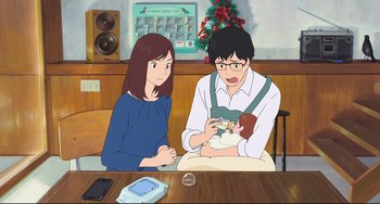 Movie still from “Mirai” (2018), directed by Mamoru Hosoda – A man and a woman sitting in front of a table; Medium shot, Over the shoulder angle