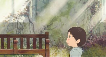 Movie still from “Mirai” (2018), directed by Mamoru Hosoda – A child sitting on top of a wooden bench near a tree; Wide shot, Over the shoulder angle