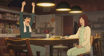 Movie still from “Mirai” (2018), directed by Mamoru Hosoda – Two people sitting at a table in a kitchen; Wide shot, High angle
