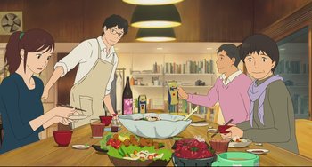 Movie still from “Mirai” (2018), directed by Mamoru Hosoda – Two men standing at a table with a bowl of food; Medium shot, High angle