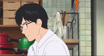 Movie still from “Mirai” (2018), directed by Mamoru Hosoda – A man with glasses is standing in a kitchen; Close Up shot, Over the shoulder angle