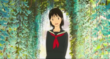 Movie still from “Mirai” (2018), directed by Mamoru Hosoda – A woman in a sailor suit standing in front of some trees; Medium shot, High angle