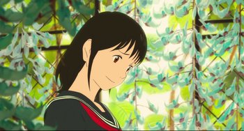 Movie still from “Mirai” (2018), directed by Mamoru Hosoda – A woman with long black hair standing in front of trees; Close Up shot, Low angle
