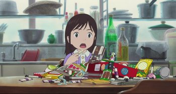 Movie still from “Mirai” (2018), directed by Mamoru Hosoda – An animated picture of a little girl sitting at a table; Medium shot, High angle