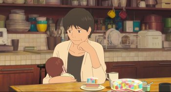 Movie still from “Mirai” (2018), directed by Mamoru Hosoda – A woman sitting at a table with a baby in her lap; Medium shot, Over the shoulder angle