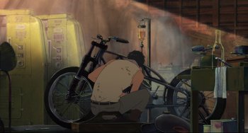 Movie still from “Mirai” (2018), directed by Mamoru Hosoda – A man sitting on the ground next to a bicycle; Wide shot, High angle