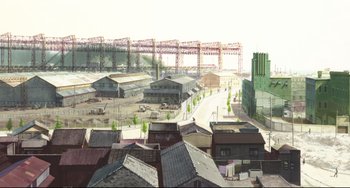 Movie still from “Mirai” (2018), directed by Mamoru Hosoda – An aerial view of a city with buildings and a bridge in the background; Extreme Wide shot, High angle
