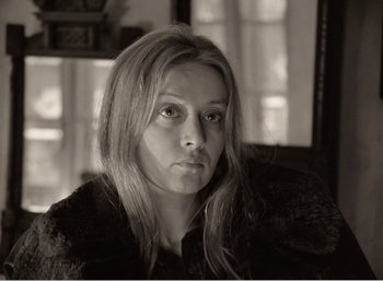 Movie still from “Mirror” (1975), directed by Andrei Tarkovsky – A black and white photo of a woman with long blonde hair; Close Up shot, Low angle