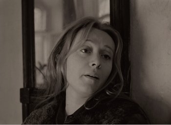 Movie still from “Mirror” (1975), directed by Andrei Tarkovsky – A black and white photo of a woman looking at the camera; Close Up shot, High angle