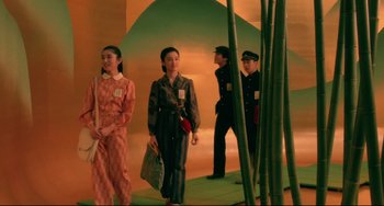 Movie still from “Mishima: A Life in Four Chapters” (1985), directed by Paul Schrader – A group of people standing next to each other in a room; Wide shot, Low angle