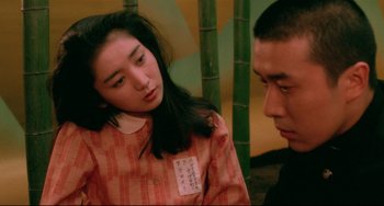 Movie still from “Mishima: A Life in Four Chapters” (1985), directed by Paul Schrader – A man and a woman are looking at each other; Close Up shot, Over the shoulder angle