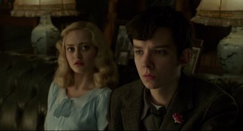 Movie still from “Miss Peregrine's Home for Peculiar Children” (2016), directed by Tim Burton – A man and a woman are looking at the camera; Close Up shot, Low angle