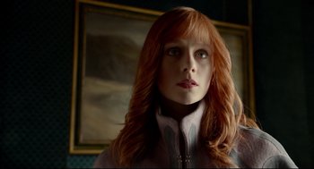 Movie still from “Miss Peregrine's Home for Peculiar Children” (2016), directed by Tim Burton – A person with long red hair; Close Up shot, Low angle