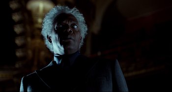 Movie still from “Miss Peregrine's Home for Peculiar Children” (2016), directed by Tim Burton – A man in a suit and white wig looking up at the ceiling; Close Up shot, Low angle