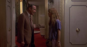 Movie still from “Missing” (1982), directed by Costa-Gavras – A man and a woman talking in front of each other; Medium shot, Over the shoulder angle