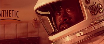 Movie still from “Mission to Mars” (2000), directed by Brian De Palma – A person wearing a space helmet; Close Up shot, Overhead angle